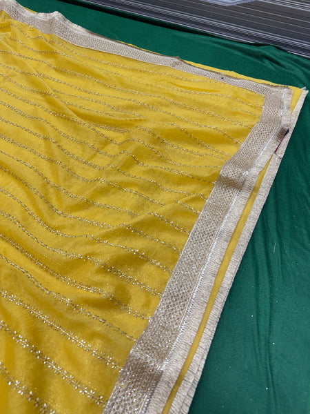 Designer Tissue Saree With Allover Work In Yellow Colour With Trending Border