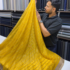 Designer Tissue Saree With Allover Work In Yellow Colour With Trending Border