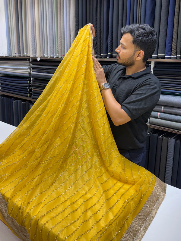 Designer Tissue Saree With Allover Work In Yellow Colour With Trending Border