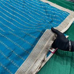 Designer Tissue Saree With Allover Work In Teal Blue Colour With Trending Border